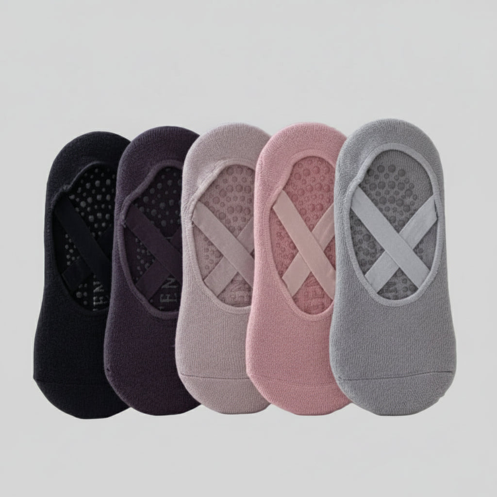 Set of five pairs of socks in black, purple, gray, pink, and gray with X design on a light gray background.